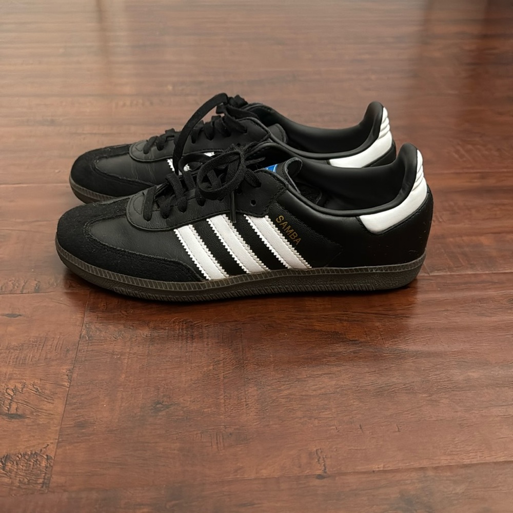Adidas’s Samba in black and white color way women’s size 7.5 and a men’s 6.5.